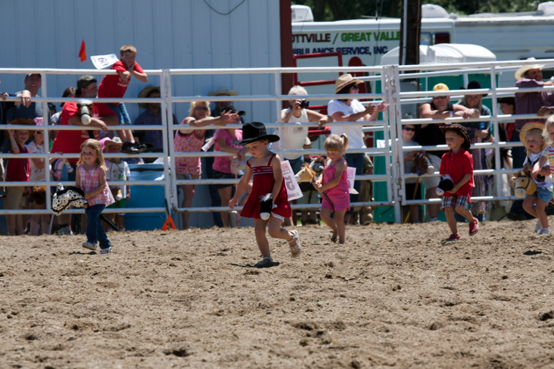 Little Kids in a stick horse race at the Ellicottville Championship Rodeo
